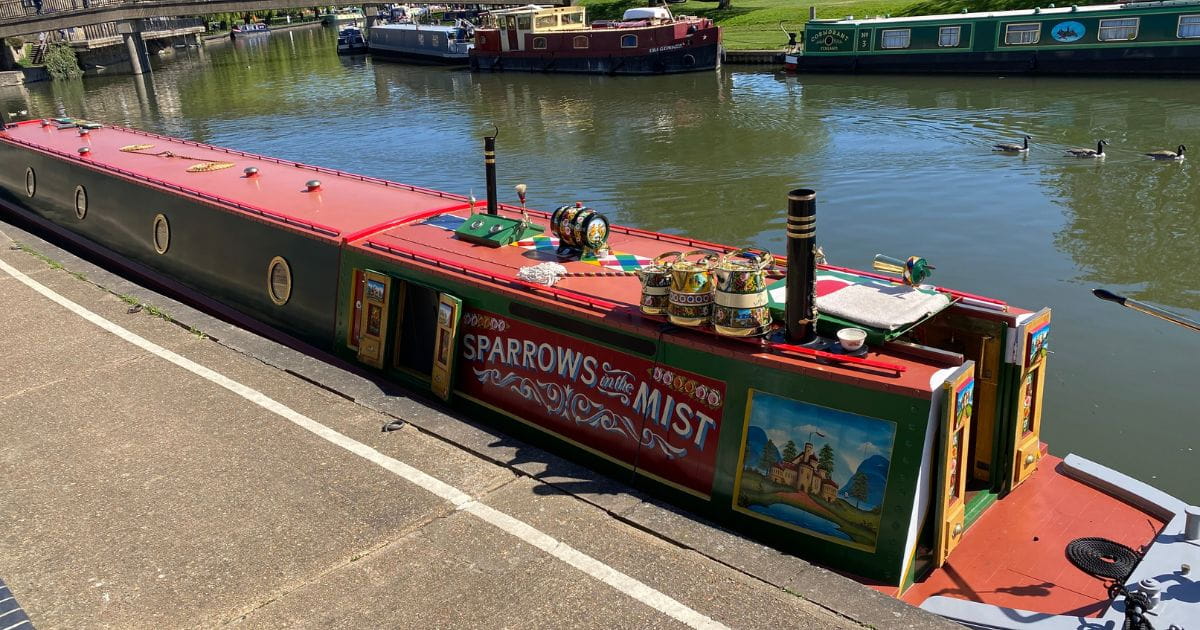 Narrowboat on the riverside in Ely