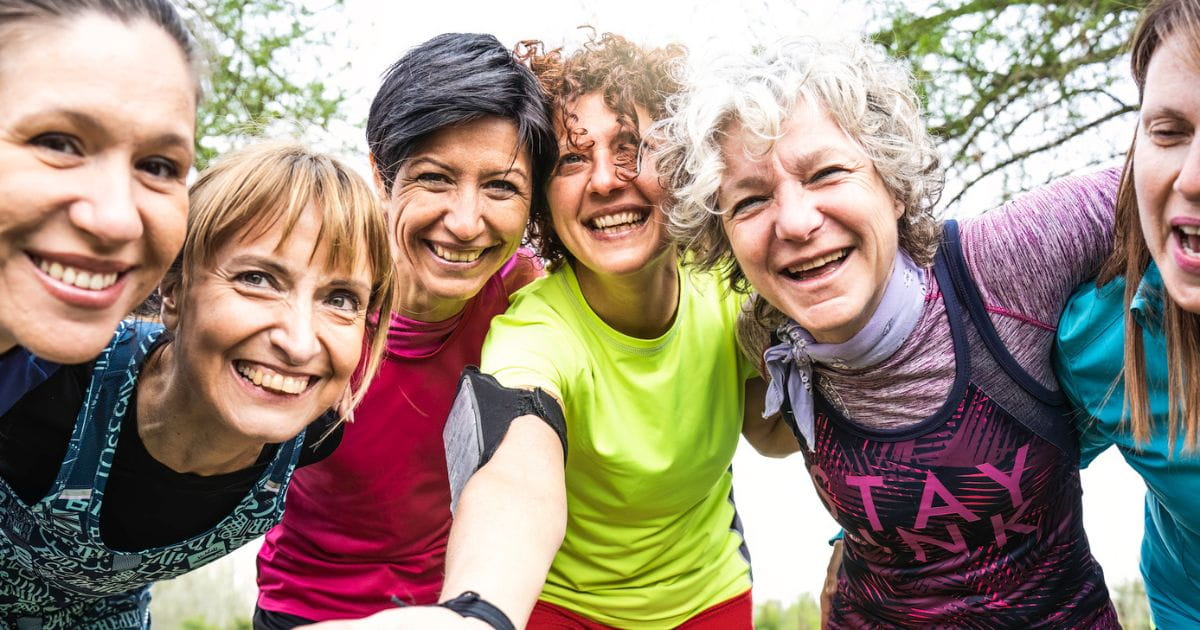 A group of women smiling at the camera
