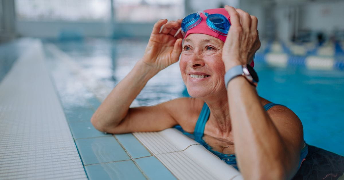 A stock image of a woman in a swimming pool