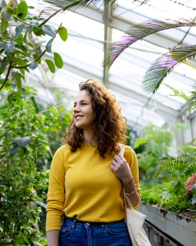 A woman in a greenhouse