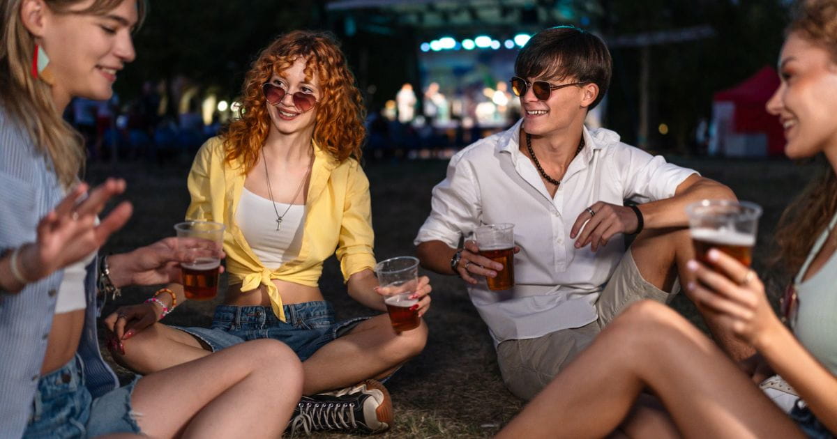 Stock image of a group at a summer festival with beer