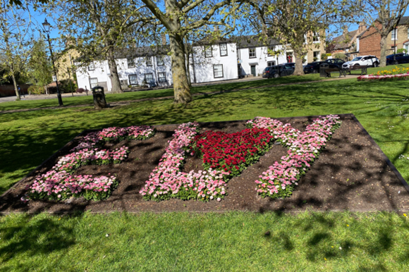 Flowerbed spelling out the word Ely