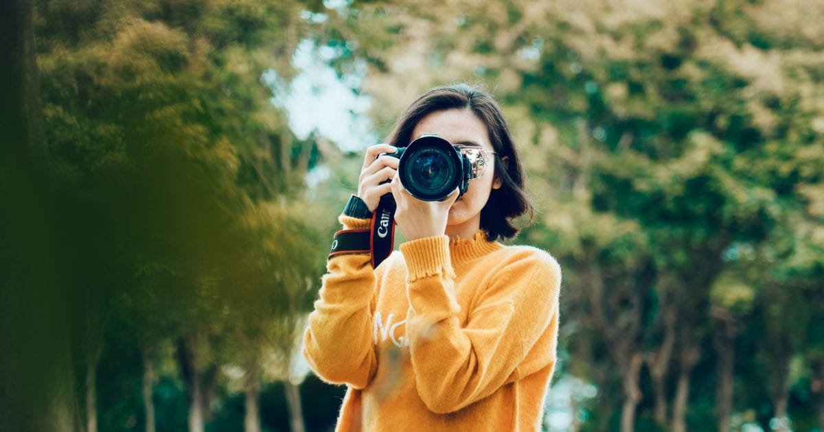 A woman holding a camera
