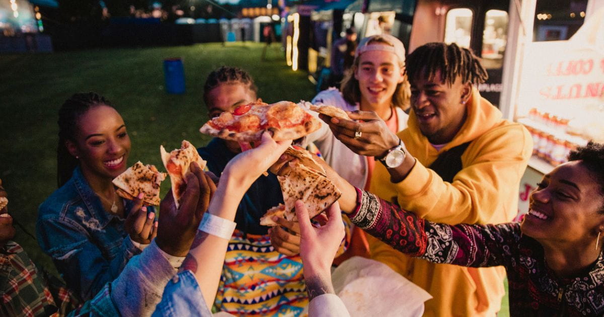 Group of friends enjoying food festival