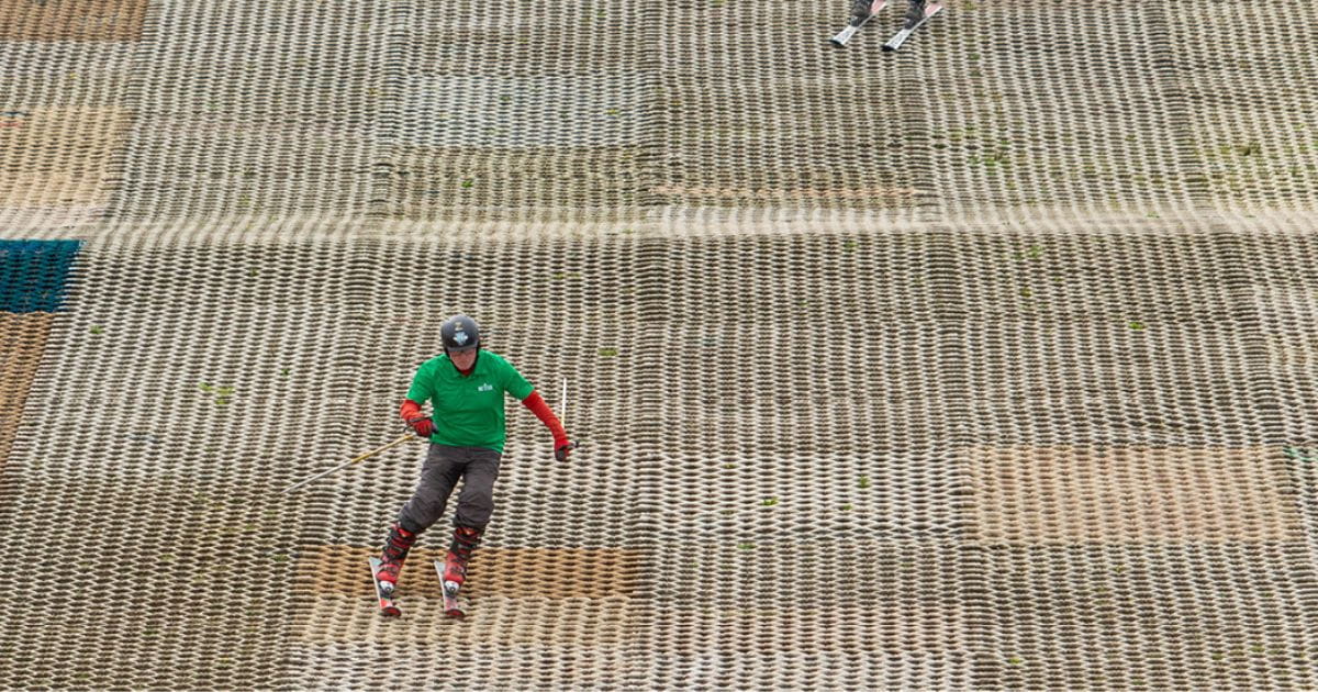 A man on a dry ski slope