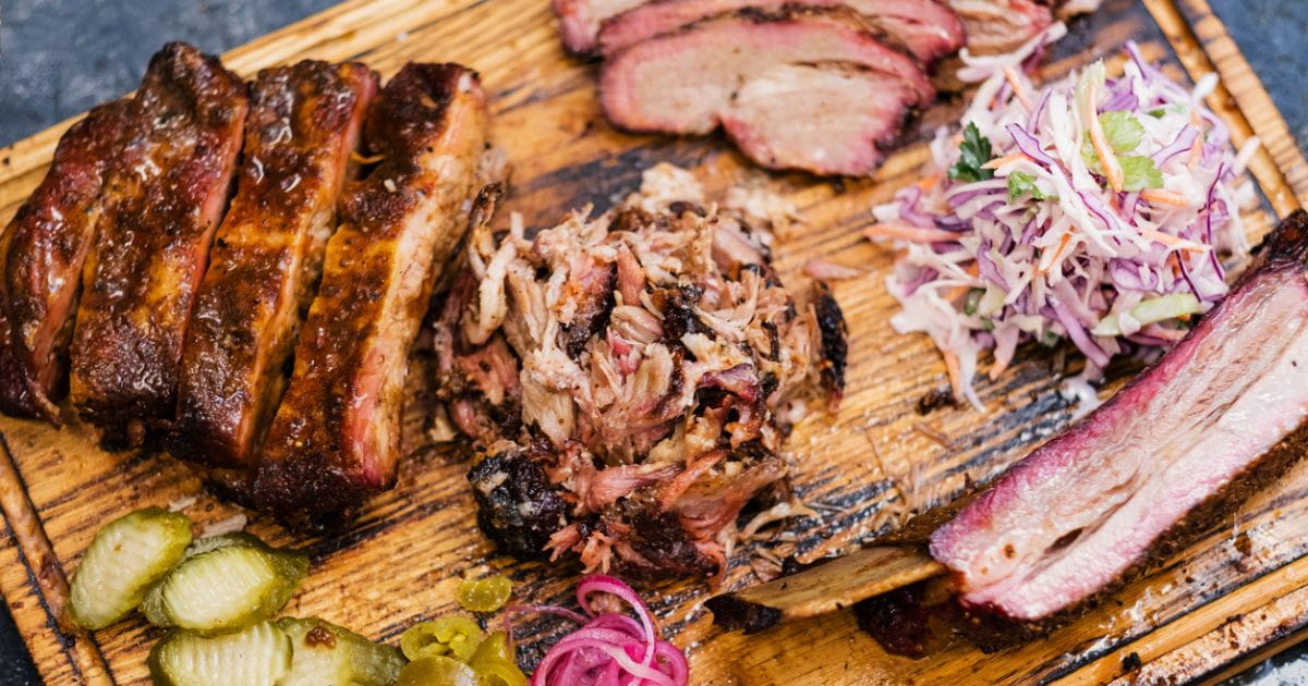 Smoked meat assortment beef brisket pulled pork stock photo